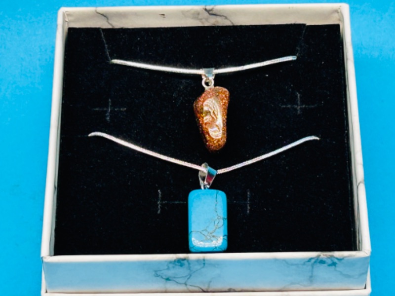 Photo 2 of 150214…  2 polished rock pendants on chains in gift box