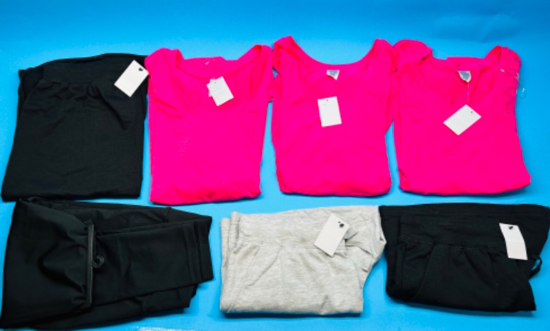 Photo 1 of 150286…woman’s size Medium shirts, shorts, leggings, and skirt 