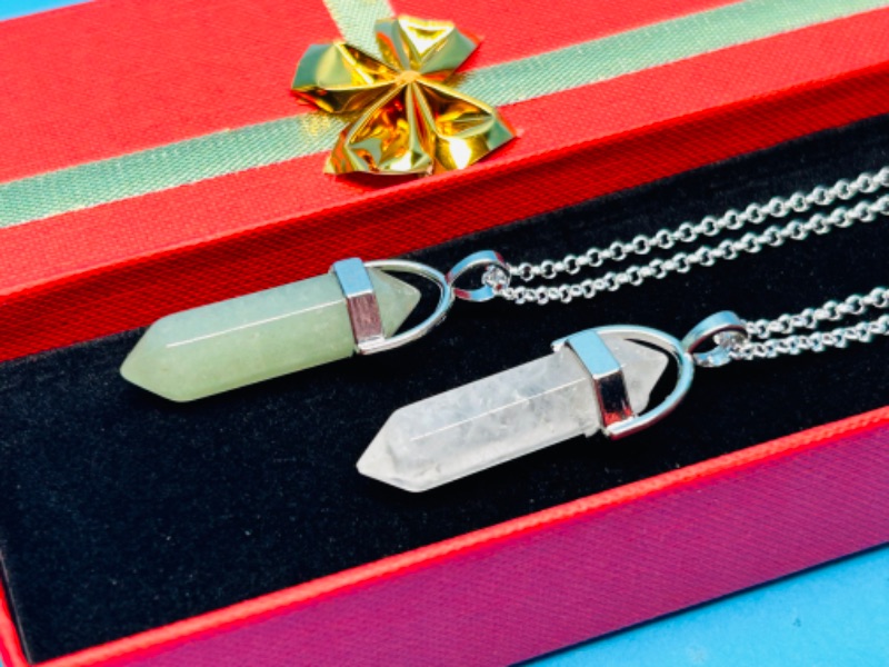 Photo 1 of 151047…2 crystal shaped polished rock pendants on chains in gift box 
