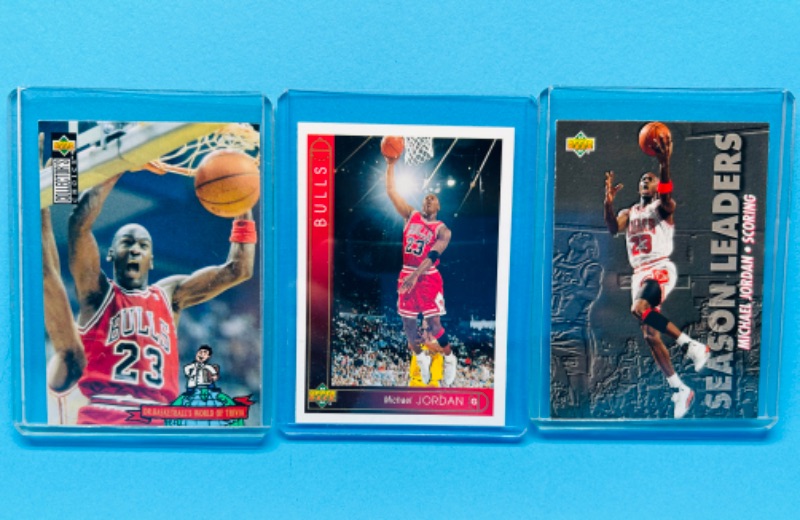 Photo 1 of 151154…3 Michael Jordan cards in hard plastic sleeves 