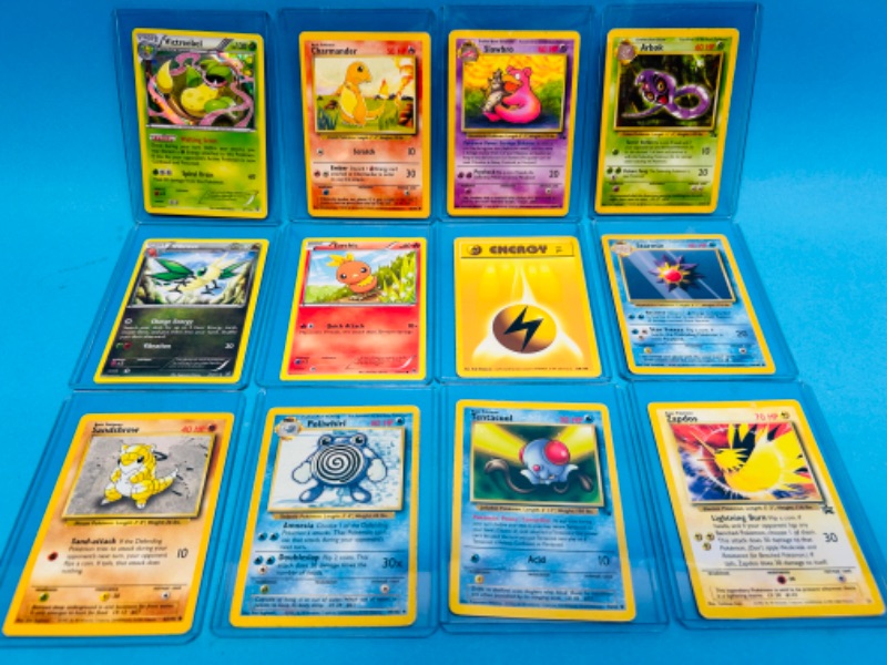 Photo 1 of 151224…12 Pokémon cards in hard plastic sleeves 