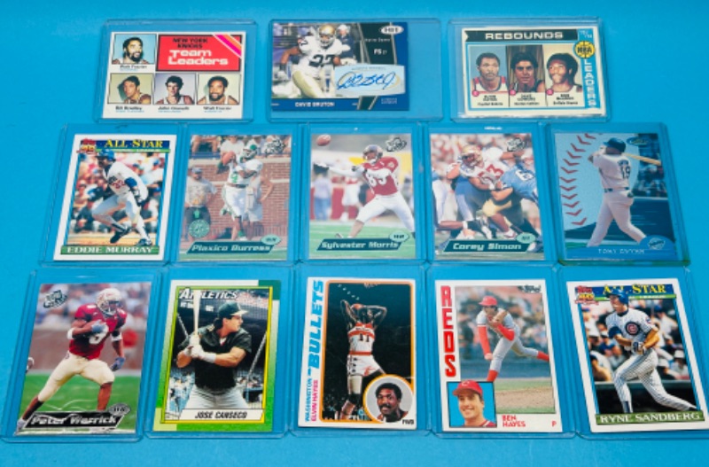 Photo 1 of 151242…sports cards  in hard plastic sleeves 