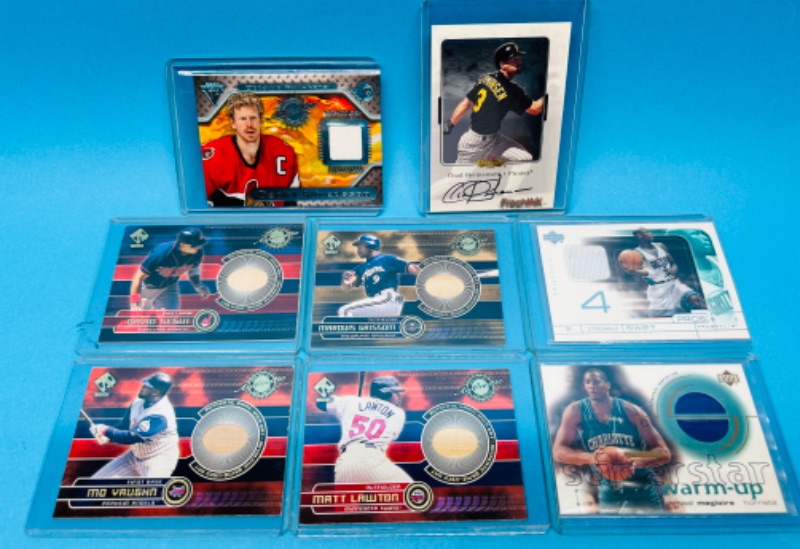 Photo 1 of 151254…8 sports jersey cards  in hard plastic sleeves 