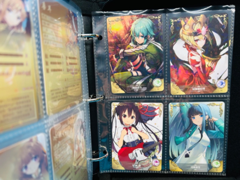 Photo 1 of 151342…60 Asian anime cards in binder 