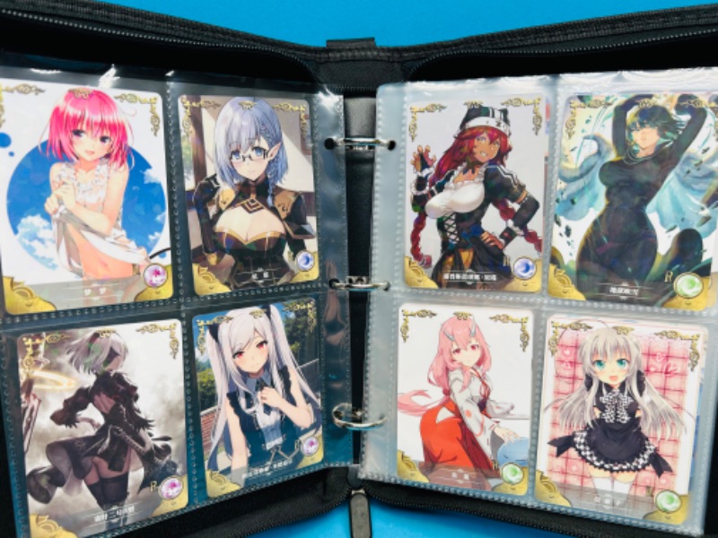 Photo 1 of 151342…60 Asian anime cards in binder 