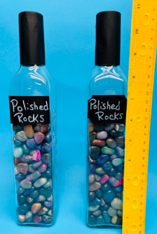 Photo 1 of 151453…2 tall bottles of polished rocks