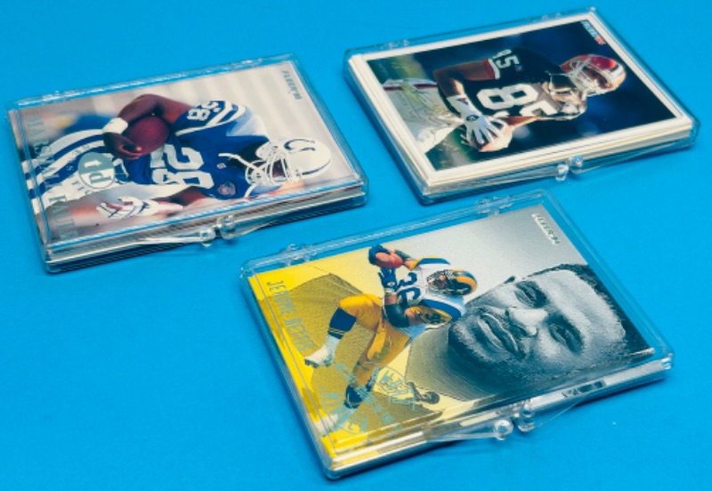 Photo 1 of 151468…3 football card sets in cases 1-5, 1-10, and 1-12