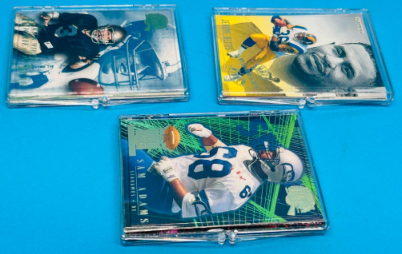 Photo 1 of 151473…3 football card sets in cases 1-5, 1-20, and 1-12