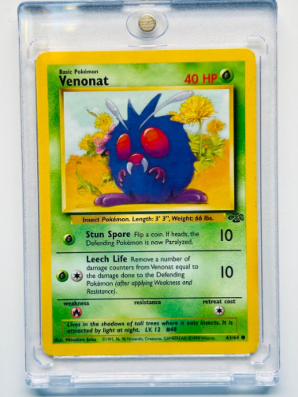 Photo 1 of 151562…Pokémon Venonat card 63/64 in hard plastic case 