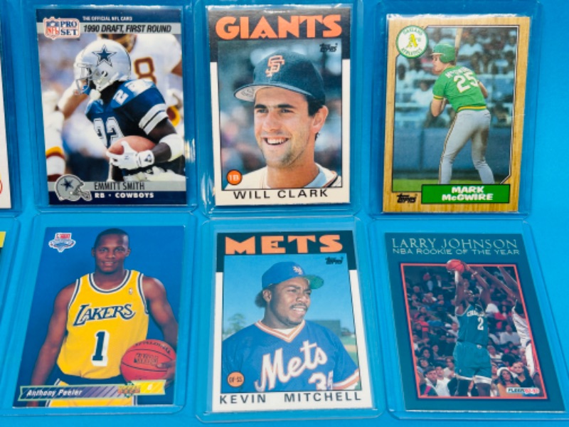 Photo 1 of 151579…8 Rookie sports cards in hard plastic sleeves 