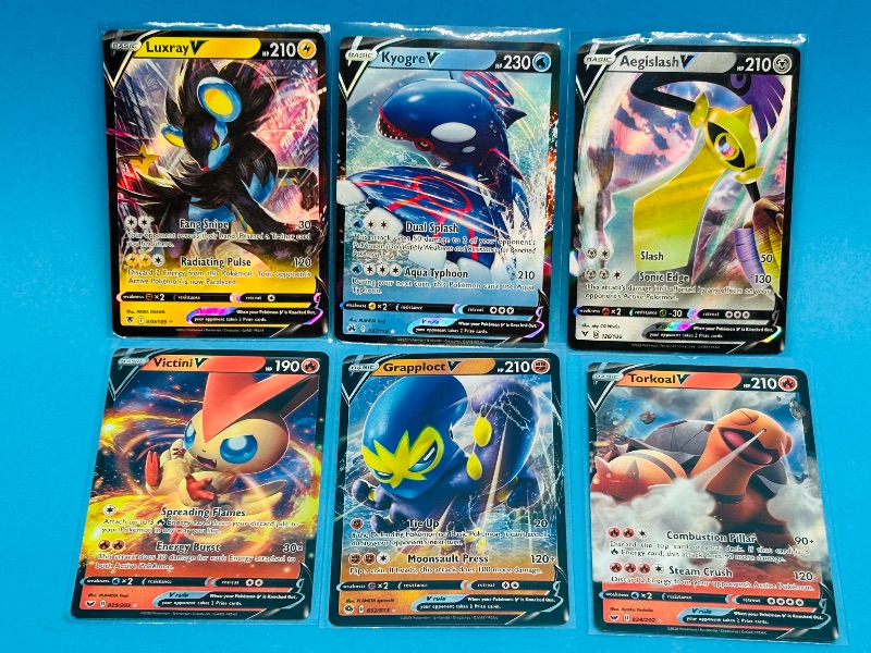 Photo 1 of 151751…6 holo Pokémon V  cards in plastic sleeves 