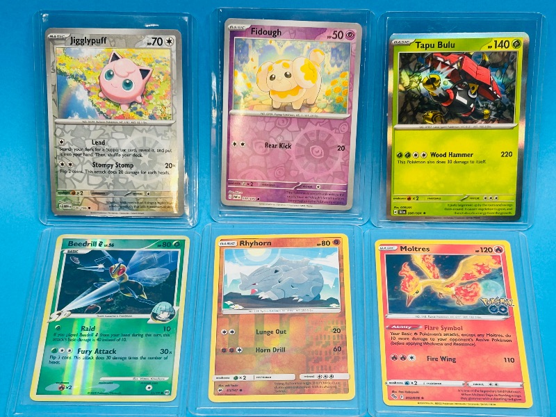 Photo 1 of 151752…6 holo and reverse holo Pokémon  cards in hard plastic sleeves 