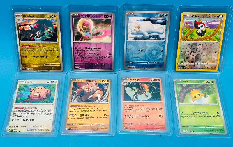 Photo 1 of 151866…  8 Pokémon reverse holo and holo cards in hard plastic sleeves 