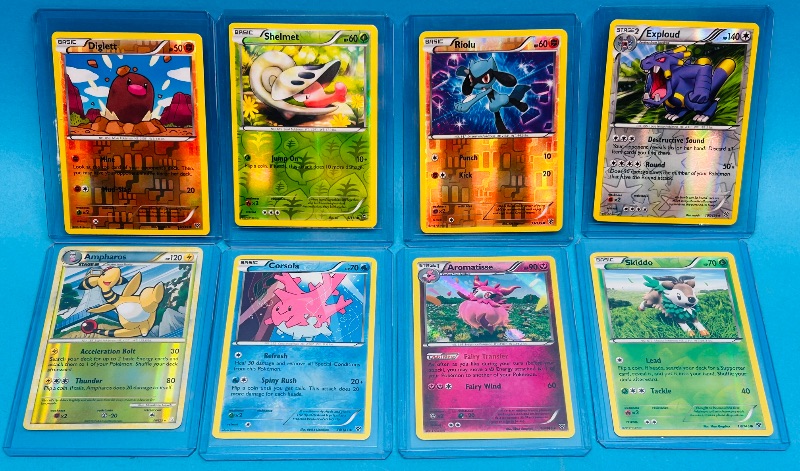 Photo 1 of 152052… 8 Pokémon reverse holo cards in hard plastic sleeves 