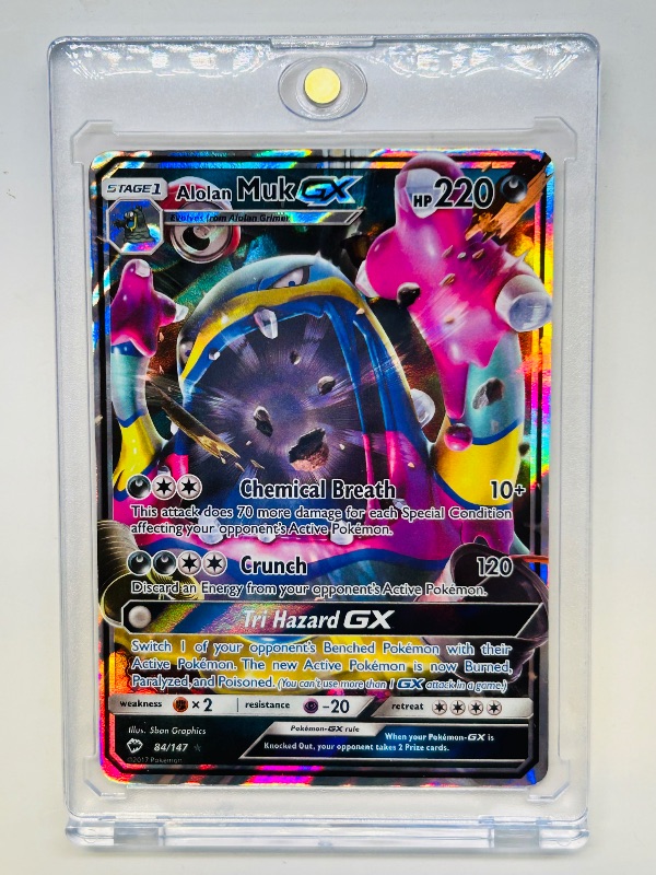 Photo 1 of 152146…Pokémon holo Alolan Muk GX card 84/147 in hard plastic case
