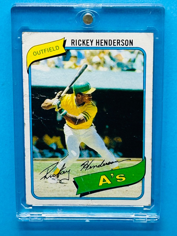 Photo 1 of 152158…Rookie Rickey Henderson card 482-condition issues-bends, stains, creases in hard plastic case