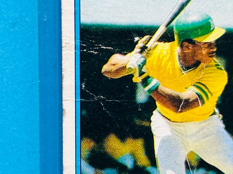 Photo 1 of 152158…Rookie Rickey Henderson card 482-condition issues-bends, stains, creases in hard plastic case