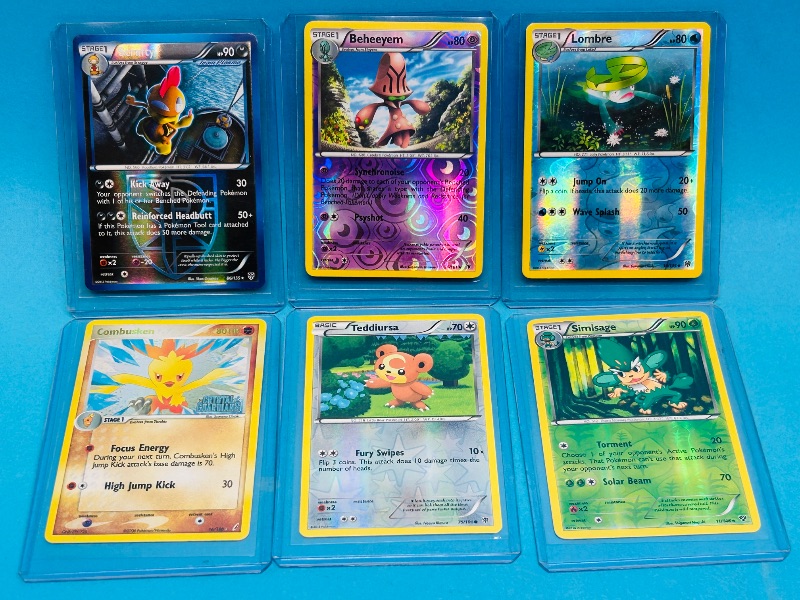 Photo 1 of 152171…6 Pokémon reverse and holo cards in plastic sleeves 