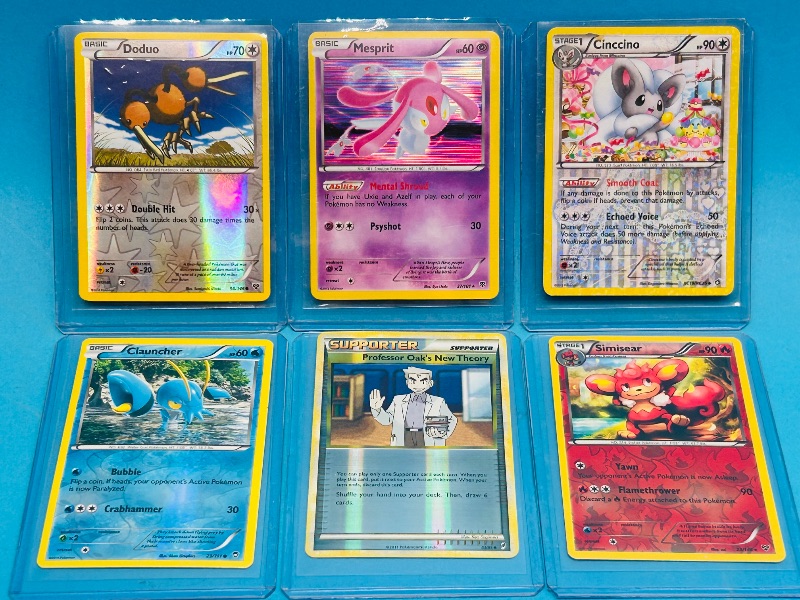 Photo 1 of 152174… 6 Pokémon reverse and holo cards in plastic sleeves 