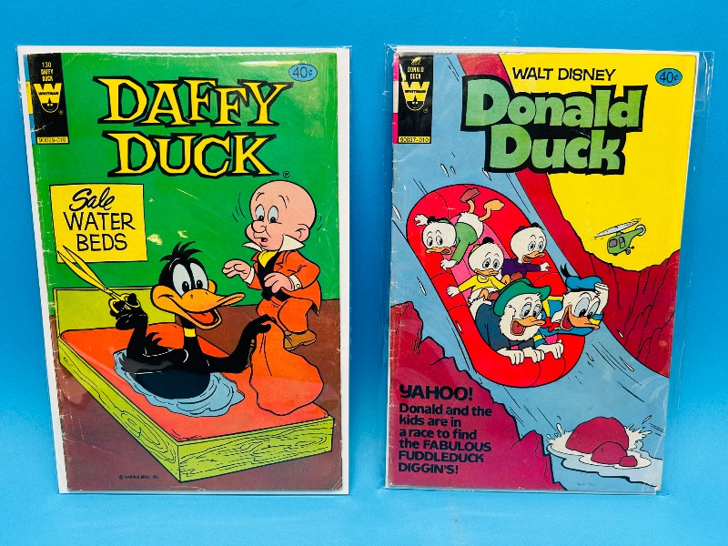 Photo 1 of 152203… 2 vintage Disney comics in plastic sleeves -wear from age