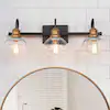 Photo 1 of 22 in. 3-Light Modern Aged Brass and Black Bathroom Vanity Light with Clear Glass Globe Shades
