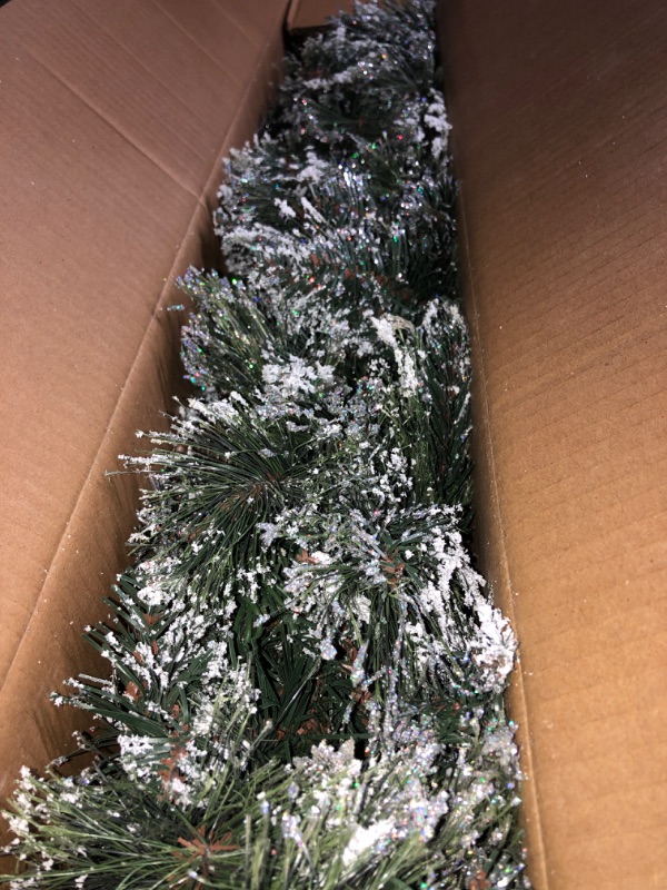 Photo 2 of National Tree Company Pre-Lit Artificial Christmas Garland, Green, Glittery Bristle Pine, White Lights, Decorated With Pine Cones _ (9 FEET) 