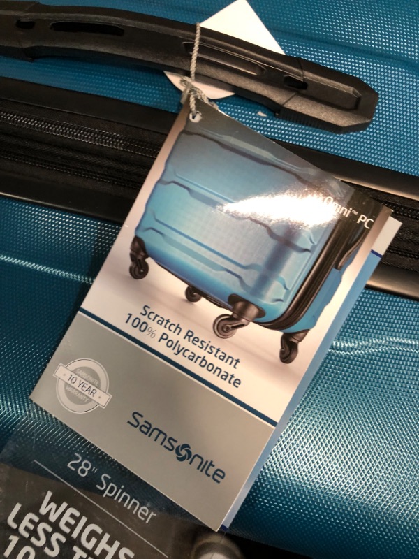 Photo 5 of  Samsonite Omni PC Hardside Expandable Luggage with Spinner Wheels, Checked-Large 28-Inch, Caribbean Blue
