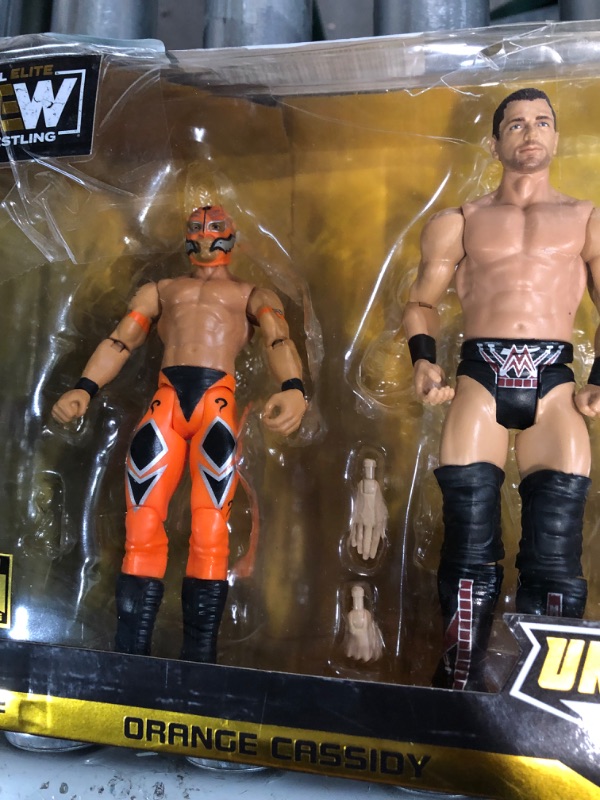 Photo 3 of **SEE NOTES**
All Elite Wrestling AEW Unrivaled Champion 4 Pack - Four 6-Inch Figures with Title Belts and Accessories - Amazon Exclusive