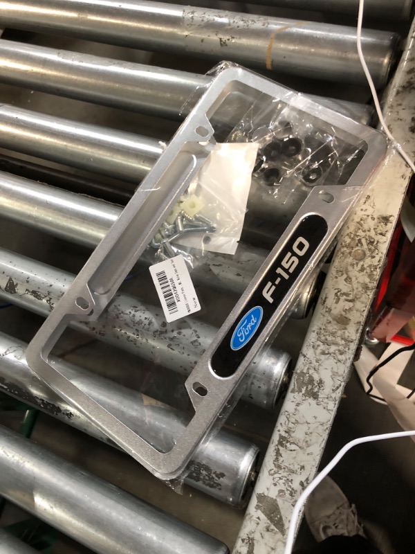 Photo 1 of Ford F-150 License Plate Frame (4 Hole/Brass, Chrome/Top)