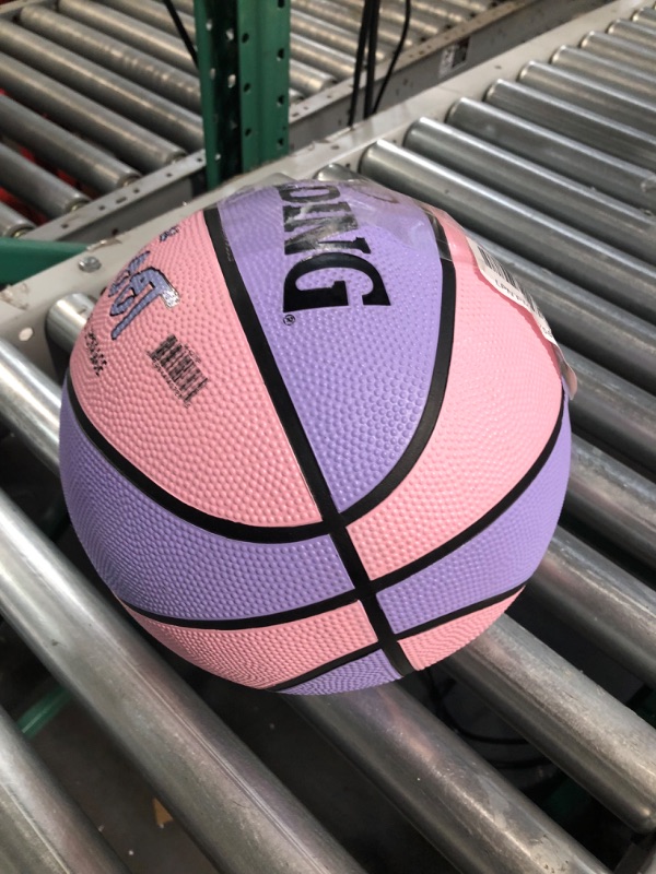 Photo 3 of * small leak * needs basketball repair kit * 
Spalding Street Outdoor Basketball Intermediate Size 6, 28.5" Pink/Purple