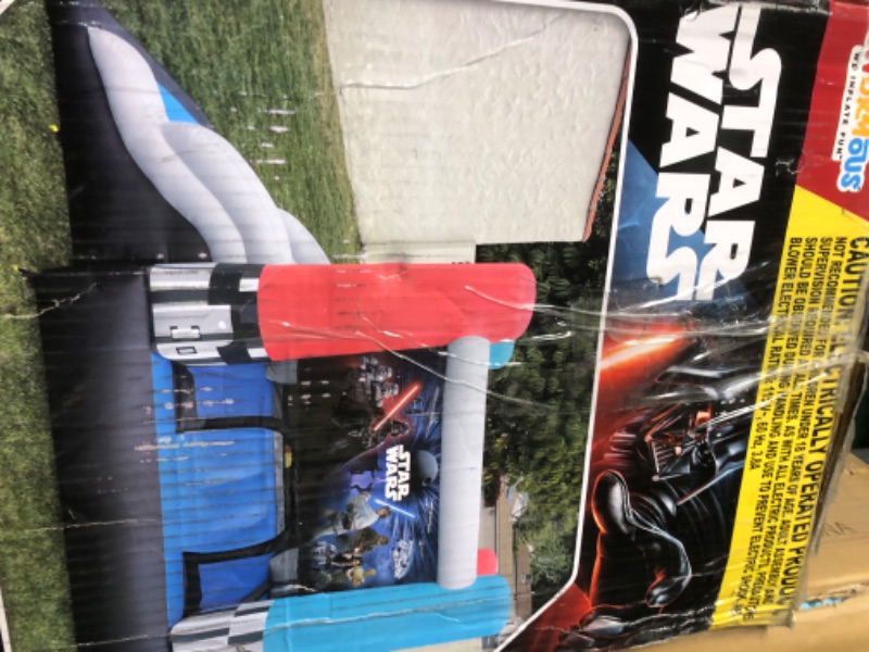 Photo 4 of **JUST THE BLOWER PUMP**
Star Wars Bounce House with Slide