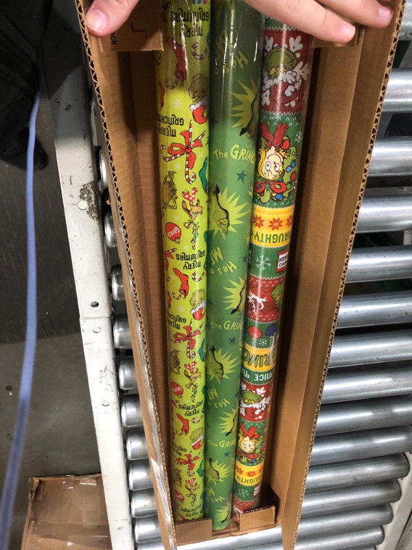 Photo 2 of American Greetings Christmas Wrapping Paper with Cut Lines Bundle, The Grinch (3 Rolls, 105 sq. ft.)