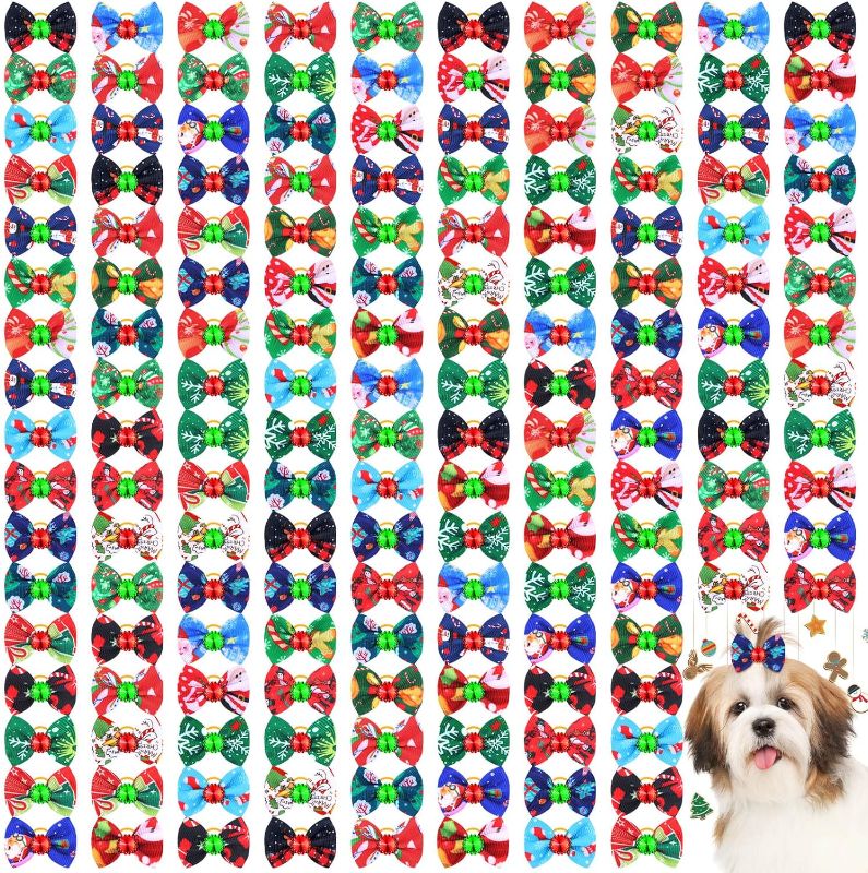 Photo 1 of 160 Pcs Christmas Dog Hair Bows Dog Topknot Bows with Rubber Bands Rhinestone Dog Grooming Bows Santa Claus Pattern