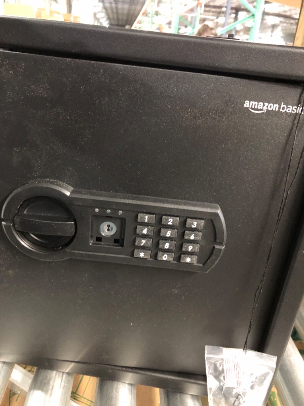 Photo 4 of **MINOR DAMAGE** **MISSING PIECE**
Amazon Basics Steel Home Security Safe with Programmable Keypad - 1.52 Cubic Feet, 13.8 x 13 x 16.5 Inches, Black 