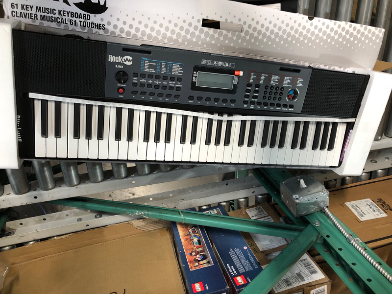 Photo 1 of **MISSING PIECES**
RockJam 49 Key Keyboard Piano