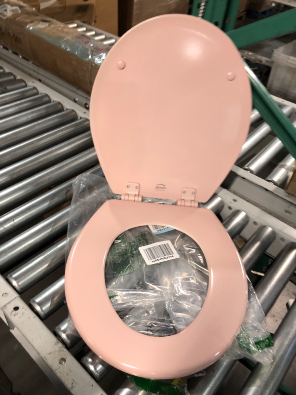 Photo 2 of **MINOR DAMAGE**
Bemis 500EC 063 Toilet Seat with Easy Clean & Change Hinges, Round, Durable Enameled Wood, Venetian Pink Venetian Pink Round