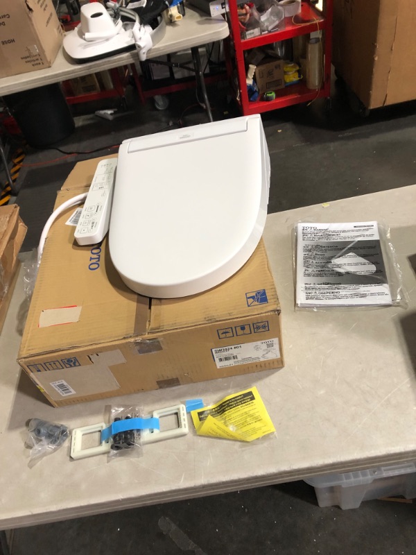 Photo 2 of ***MAJOR DAMAGE - CORNER CRACKED - SEE PICTURES - UNABLE TO TEST***
TOTO WASHLET KC2 Electronic Bidet Toilet Seat with Heated Seat and SoftClose Lid, Elongated, Cotton White - SW3024