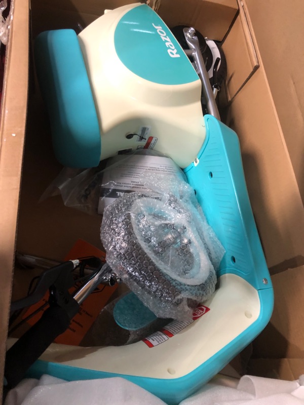 Photo 1 of Razor Pocket Mod Petite - 12V Miniature Euro-Style Electric Scooter for Ages 7+, 100-watt Motor, Up to 40 min Ride Time, For Riders up to 110 lbs