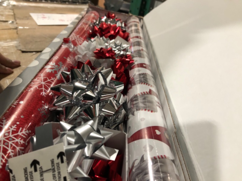 Photo 1 of Reversible Wrapping Paper Christmas Bundle with Bows, Ribbon, and Gift Tags (4 Rolls with 29 Coordinated Bows, 2 Spools of Ribbons, and 24 Gift Tags)