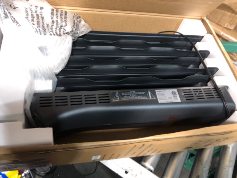 Photo 2 of ***POWERS ON - UNABLE TO TEST FURTHER***
Amazon Basics Portable Digital Radiator Heater with 7 Wavy Fins and Remote Control, Black, 1500W Digital Control