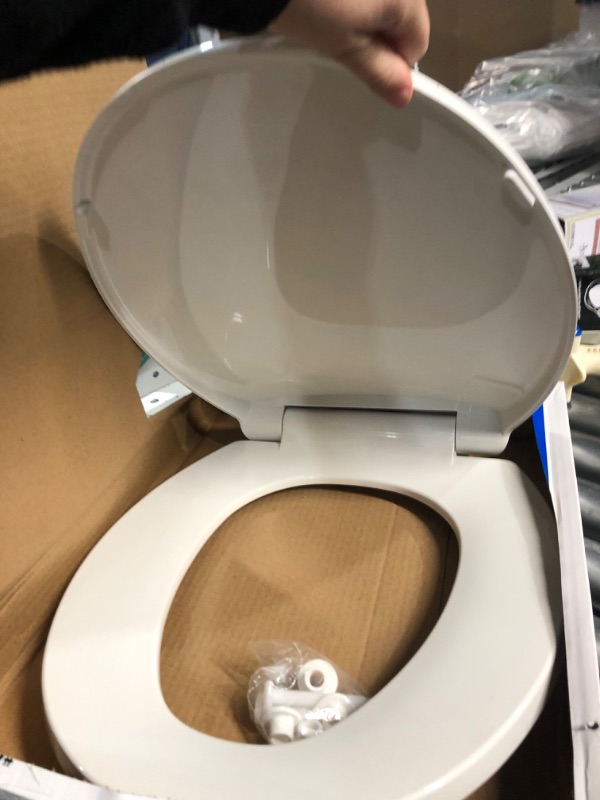 Photo 3 of  Closed Front White Plastic Deluxe Toilet Seat - 1 Each