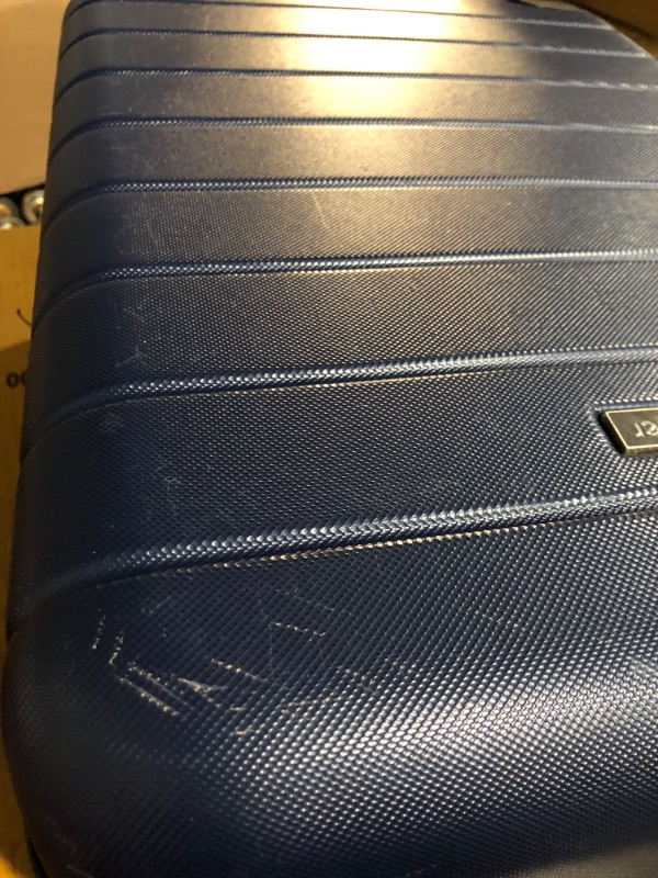 Photo 5 of **HEAILYUSED/DAMAGED**
Wrangler Smart Luggage Set with Cup Holder and USB Port, Navy Blue, 20-Inch