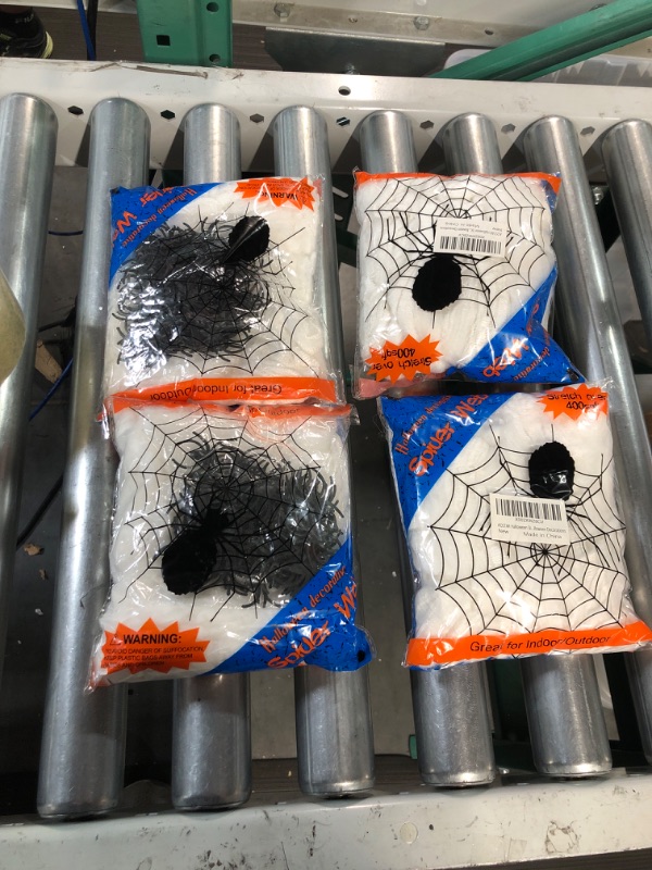 Photo 2 of AOSTAR Halloween Stretch Spider Webs Indoor & Outdoor Spooky Spider Webbing with 50 Fake Spiders for Halloween Decorations 4 Pack