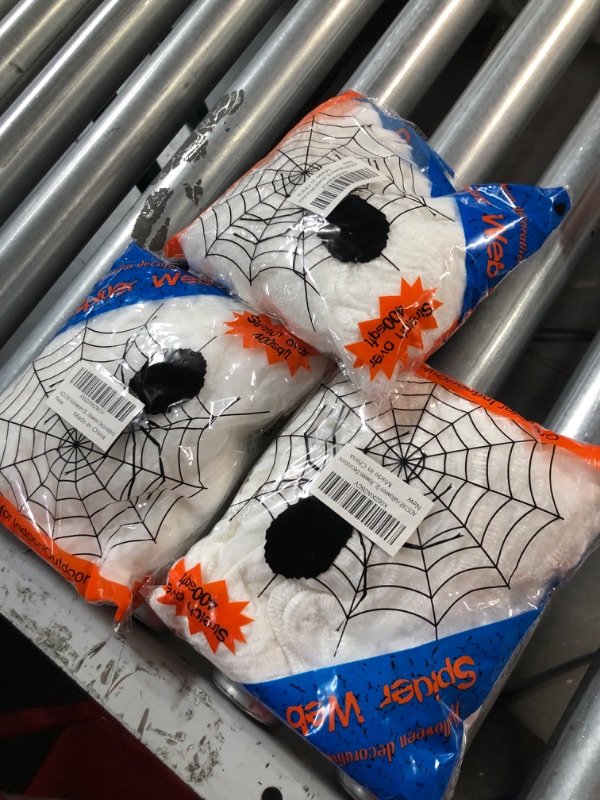 Photo 2 of AOSTAR Halloween Stretch Spider Webs Indoor & Outdoor Spooky Spider Webbing with 50 Fake Spiders for Halloween Decorations 3 pack