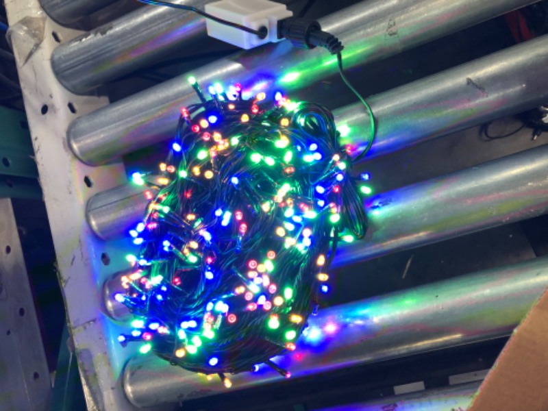 Photo 2 of OUTYLTS Christmas String Lights Outdoor Indoor, 300LED Extend 9 Modes Color Changing Tree Lights Warm White Multi Color Christmas Lights