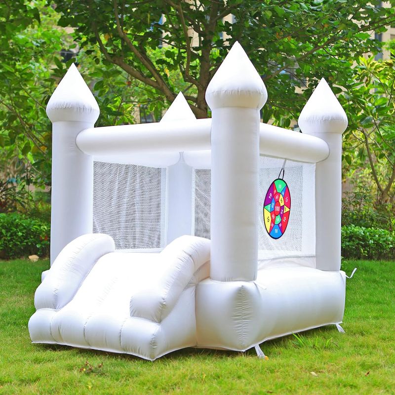 Photo 1 of **Stock photo for reference** Inflatable bounce house with games