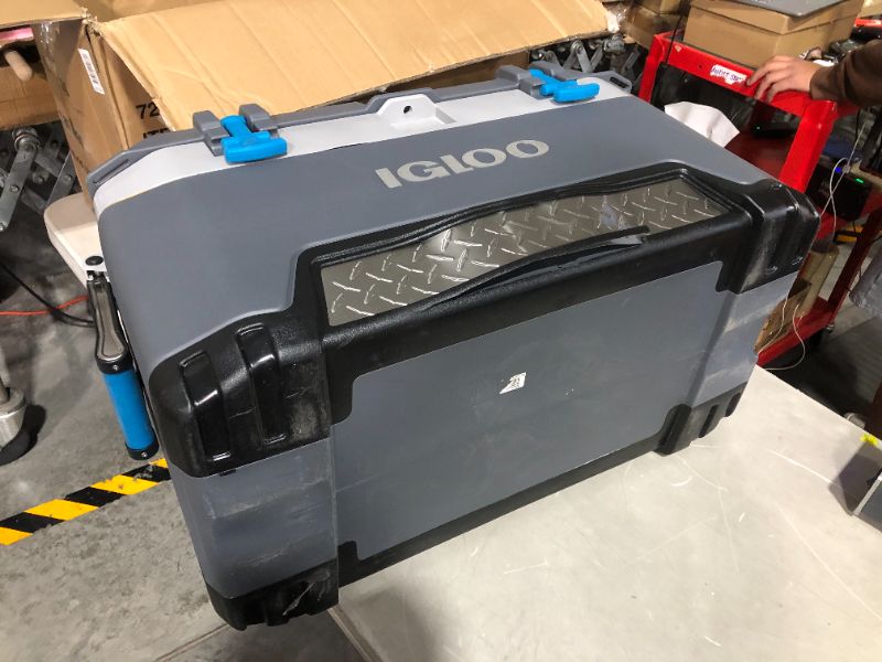 Photo 3 of ***MAJOR DAMAGE - SEE PICTURES***
Igloo BMX 72 Quart Cooler with Cool Riser Technology, Fish Ruler, and Tie-Down Points Carb/Grey/Blue