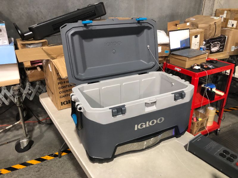 Photo 2 of ***MAJOR DAMAGE - SEE PICTURES***
Igloo BMX 72 Quart Cooler with Cool Riser Technology, Fish Ruler, and Tie-Down Points Carb/Grey/Blue