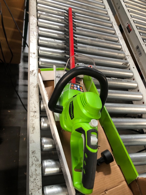 Photo 2 of * not functional * sold for parts * 
Greenworks 4 Amp 22" Corded Electric Dual-Action Hedge Trimmer & 5.5 Amp 15" Corded Electric String Trimmer