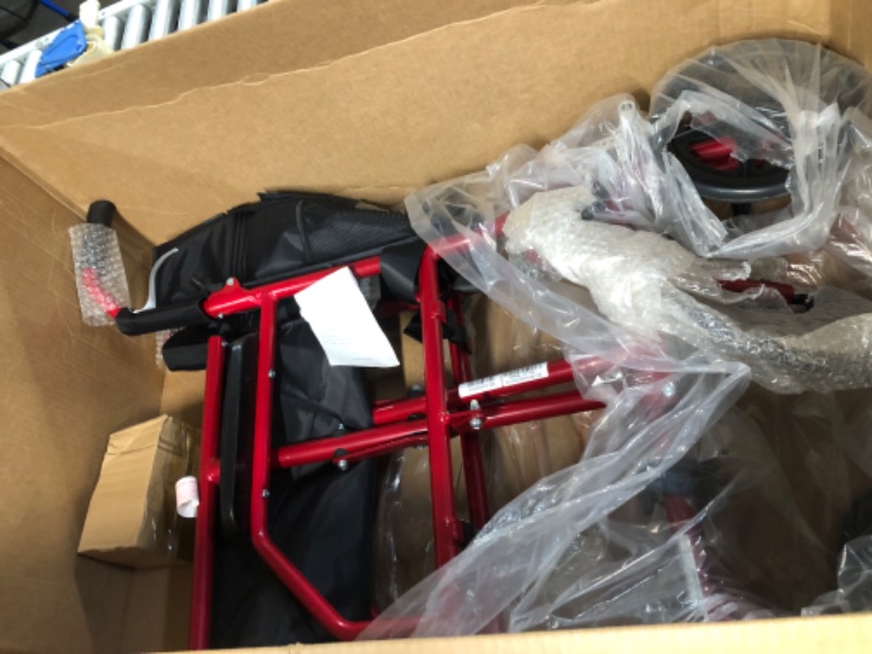 Photo 5 of ***ONE OF THE FOOT RESTS IS MISSING***
Medline Ultralight Transport Wheelchair with 19” Wide Seat, Folding, Red Frame